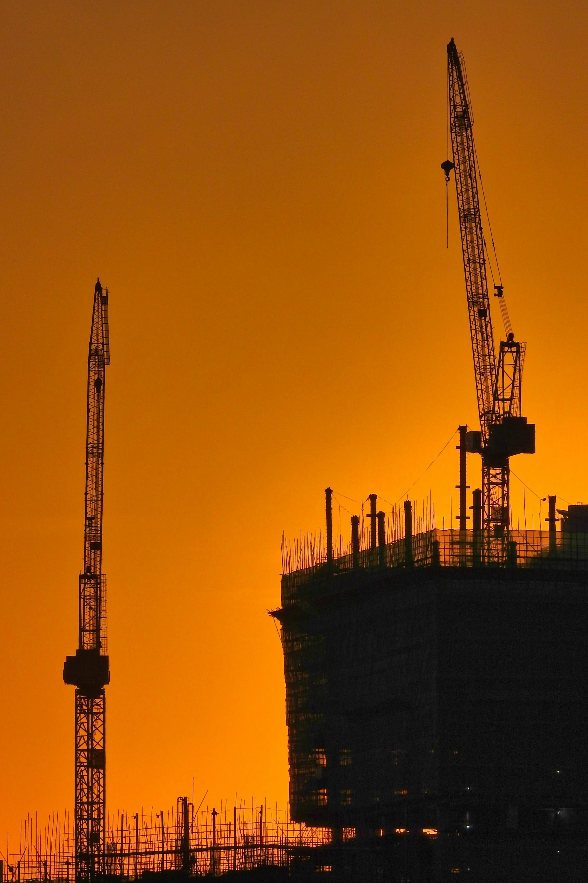 Industrial cranes at dusk
